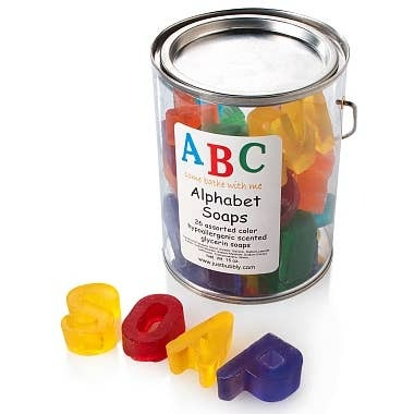 Colorful alphabet soap letters in a paint can labeled 'ABC Alphabet Soaps'.