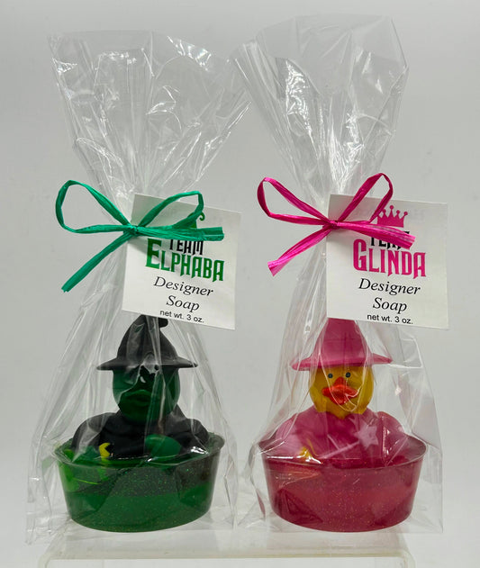Glinda & Elphaba rubber duck toy in colored soap with dish in a cello bag ited with ribbon and themed tag