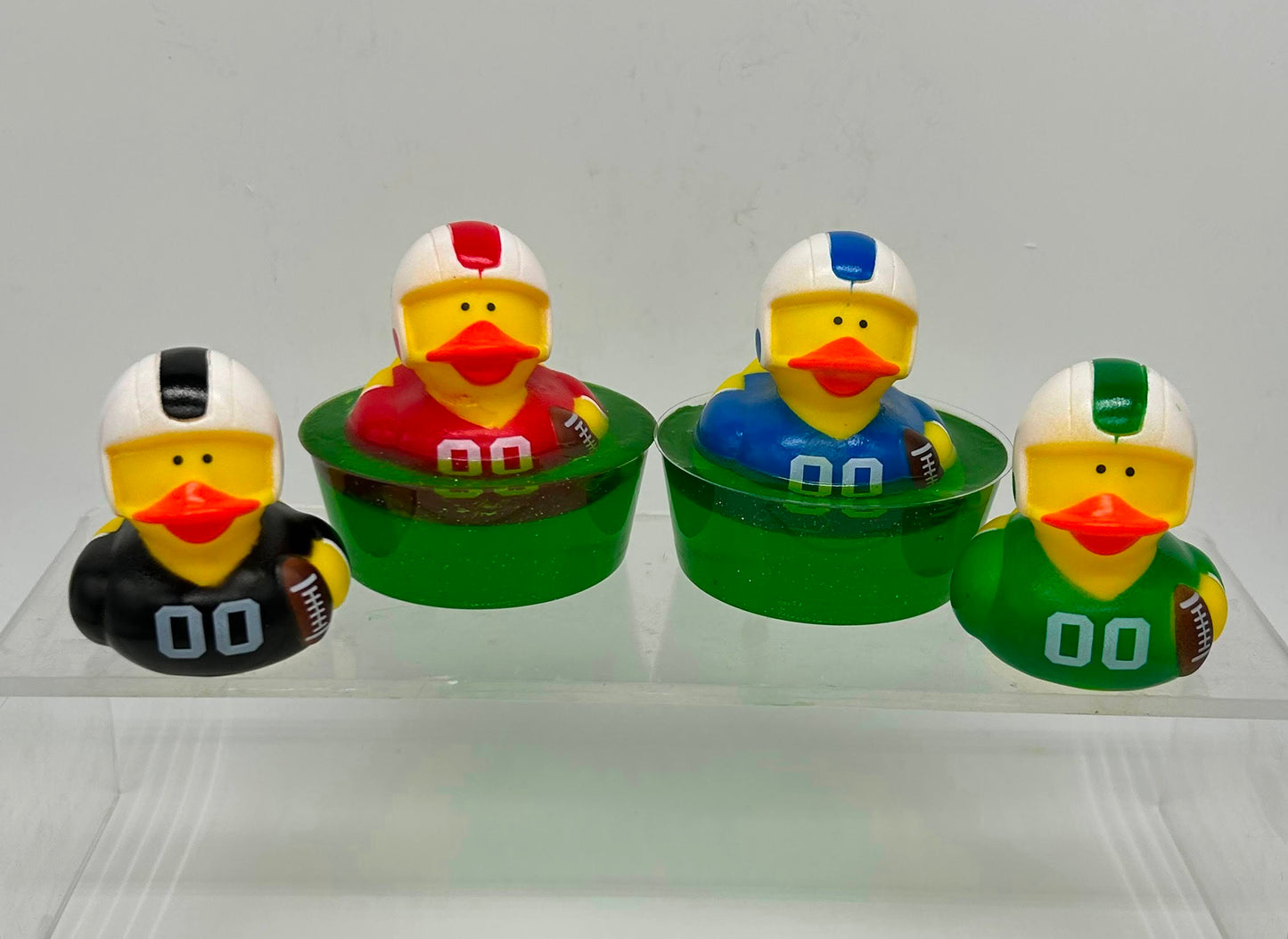 Four differnt football soap ducks for kids in different color jerseys