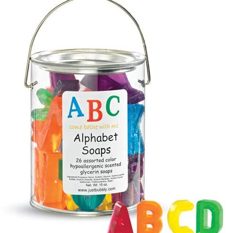 Clear bucket of alphabet soaps with colorful letters on a white background